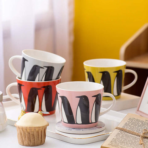Nordic style ceramic coffee mugs with penguin design in white, pink, yellow, and gray, perfect for couples.