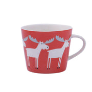 Red ceramic mug with white moose pattern, perfect for a Nordic-style coffee experience.