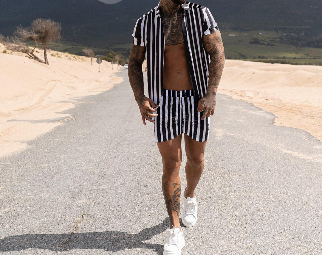 Men Printed Shirts casual summer wear with striped pattern and short sleeves walking on the road in the desert.