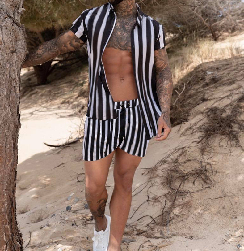 Men Printed Shirts casual summer wear featuring a man with tattoos in striped shirt and shorts on the beach.